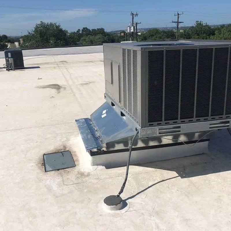 HVAC technician servicing an air conditioning unit
